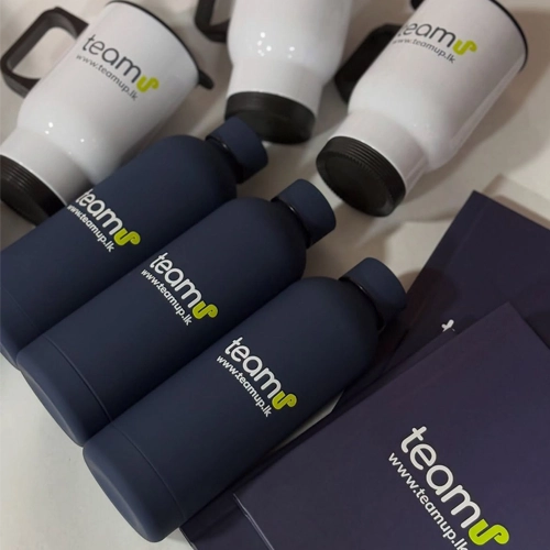 Custom branded mugs, bottles, and folders with TeamUp logo