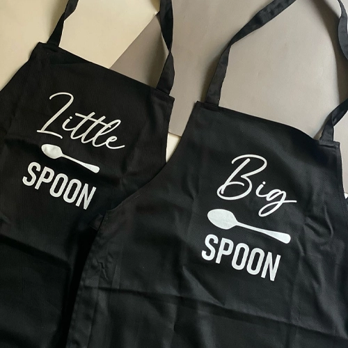 Matching black aprons with Big Spoon and Little Spoon designs